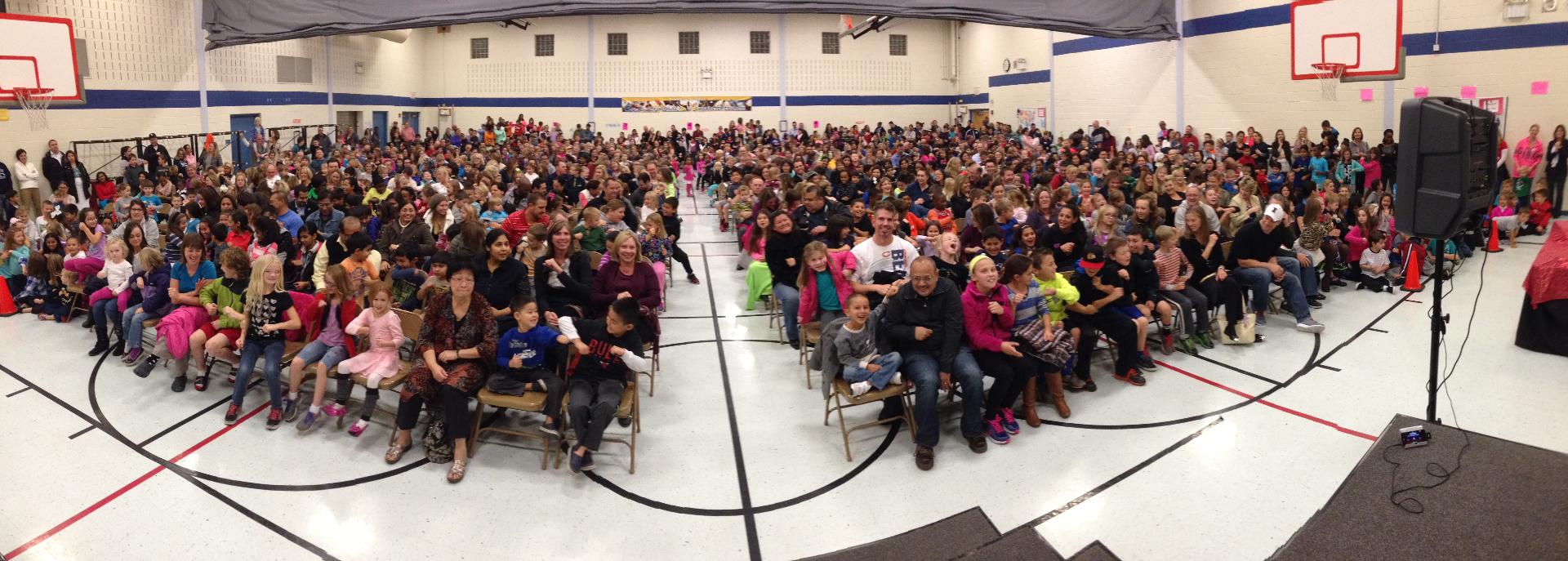 Panoramic view of a packed Family Night crowd from the stage