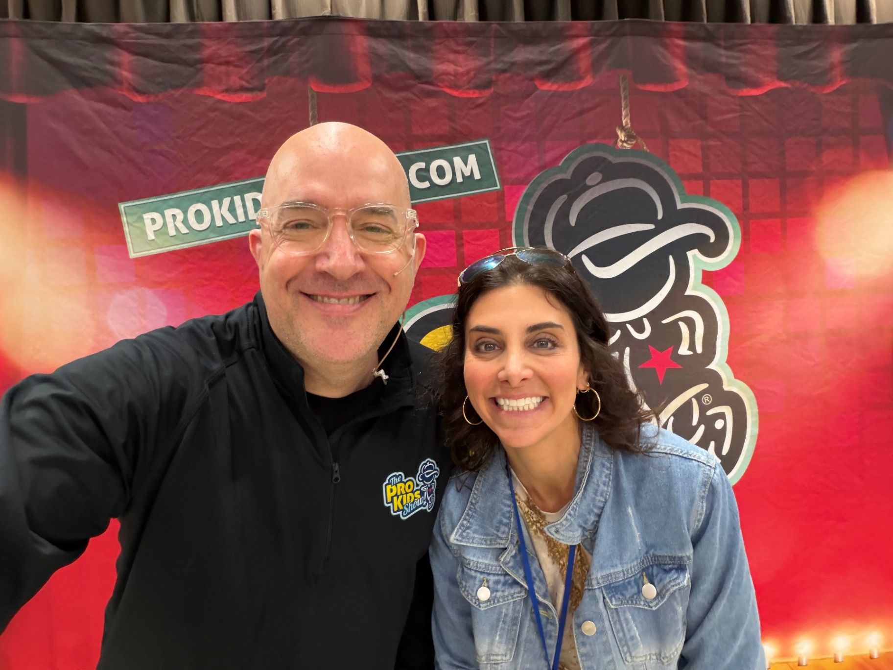 Tim with a staff member after a Pro-Kids Show visit to Scott Elementary