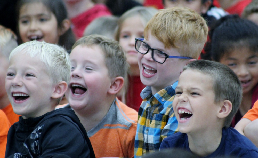 Laughter fills the room. Kids are kids again.