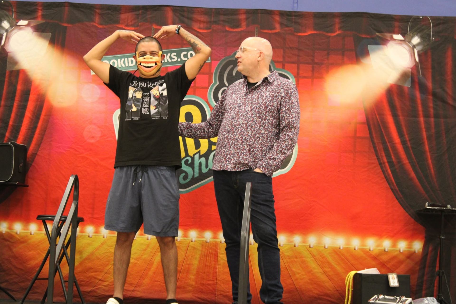 Having fun with a dad on stage.