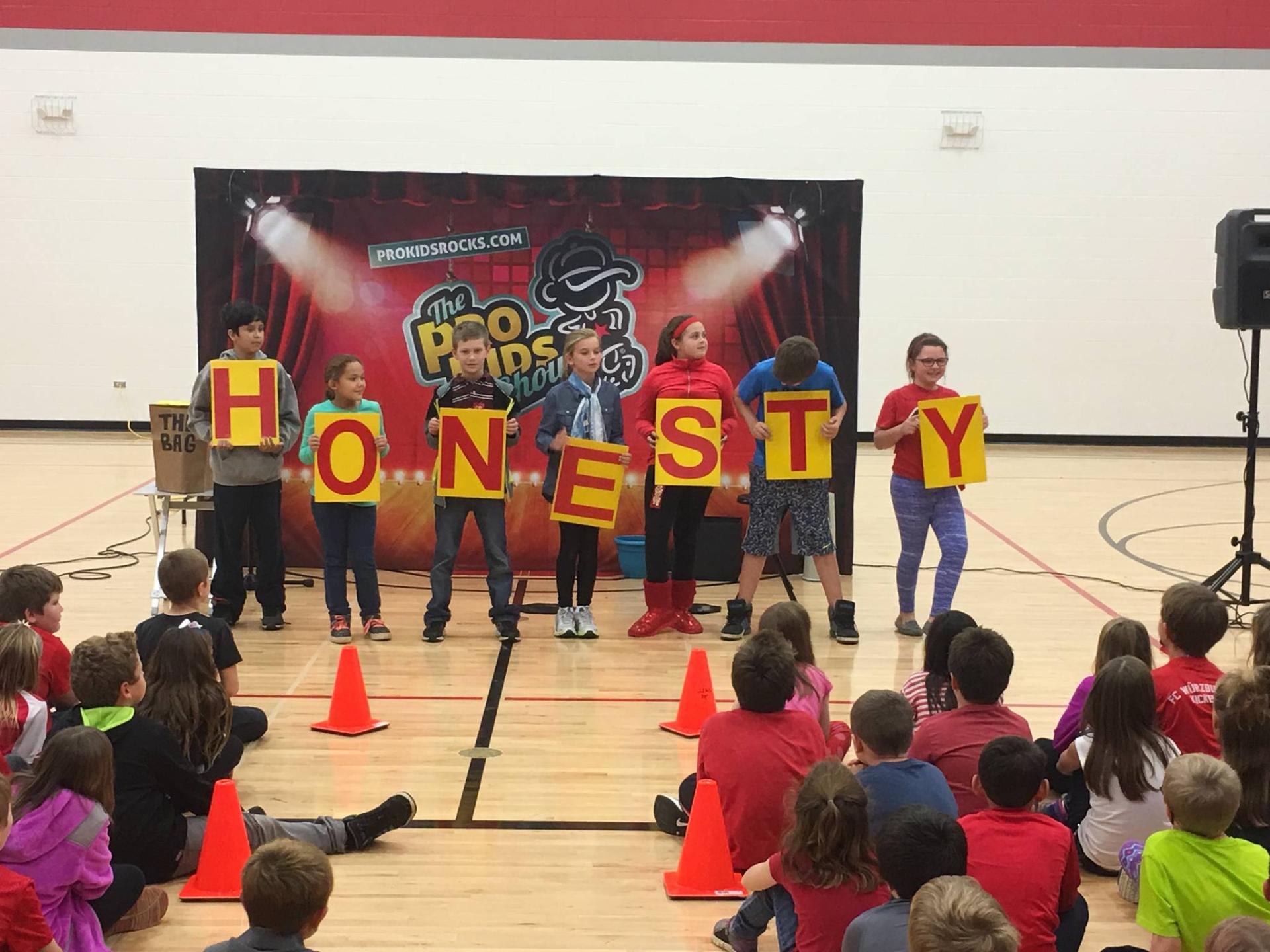Tim on stage during a character-building moment
