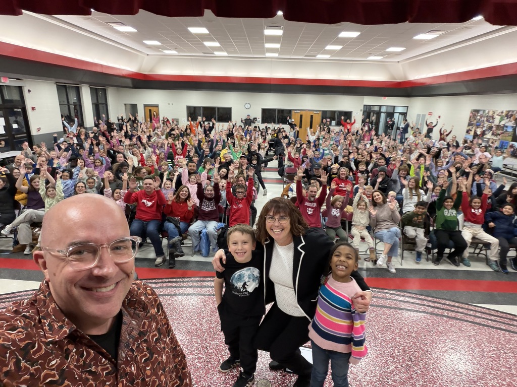 Tim's onstage selfie with the principal, two students, and the entire Family Night crowd packed in behind