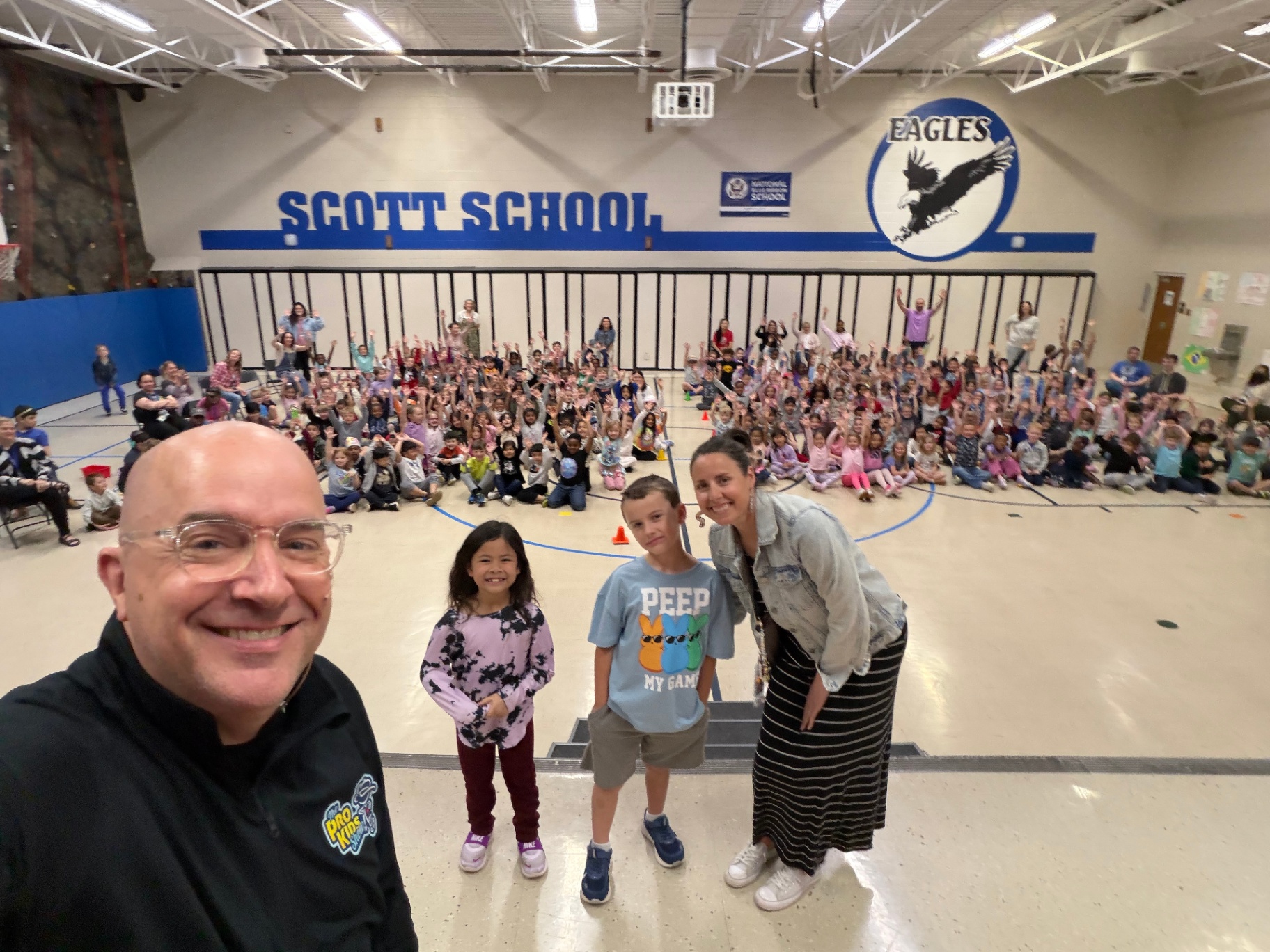 A wide group photo after a Pro-Kids Show visit to Scott Elementary