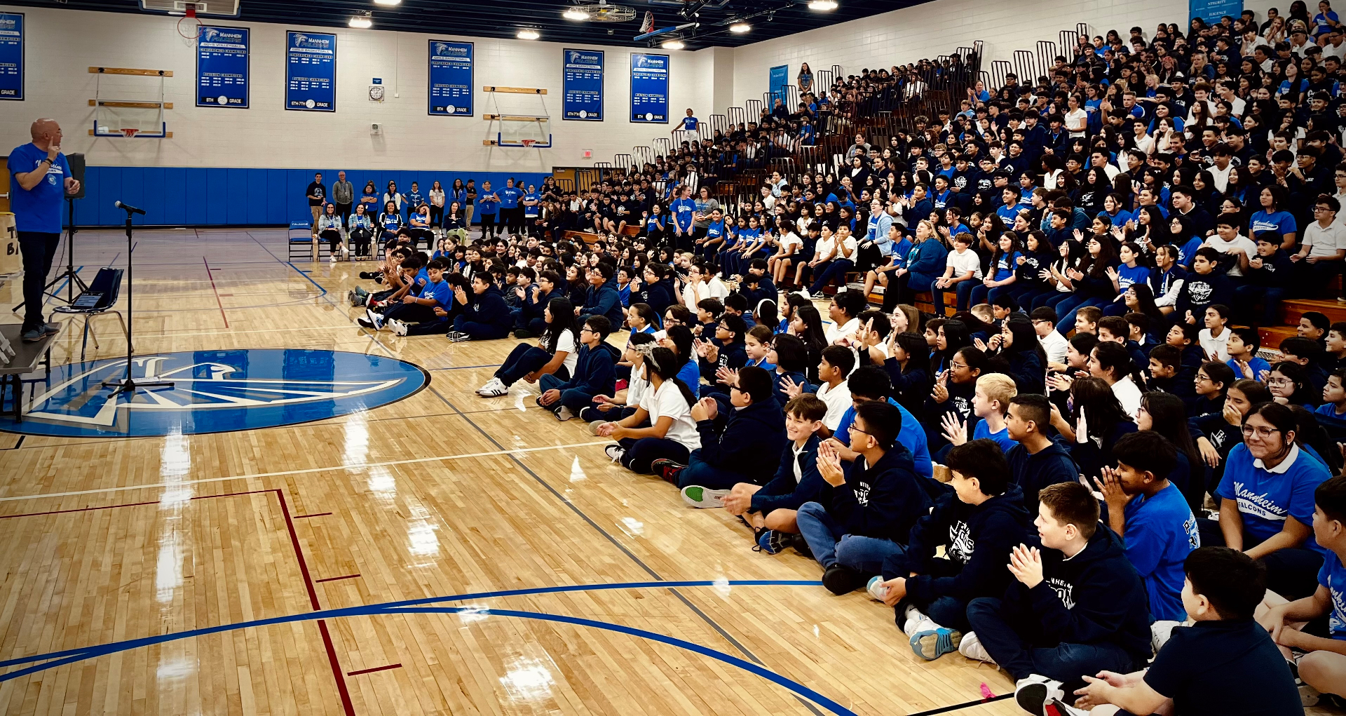 Wide view of a middle school audience during the show