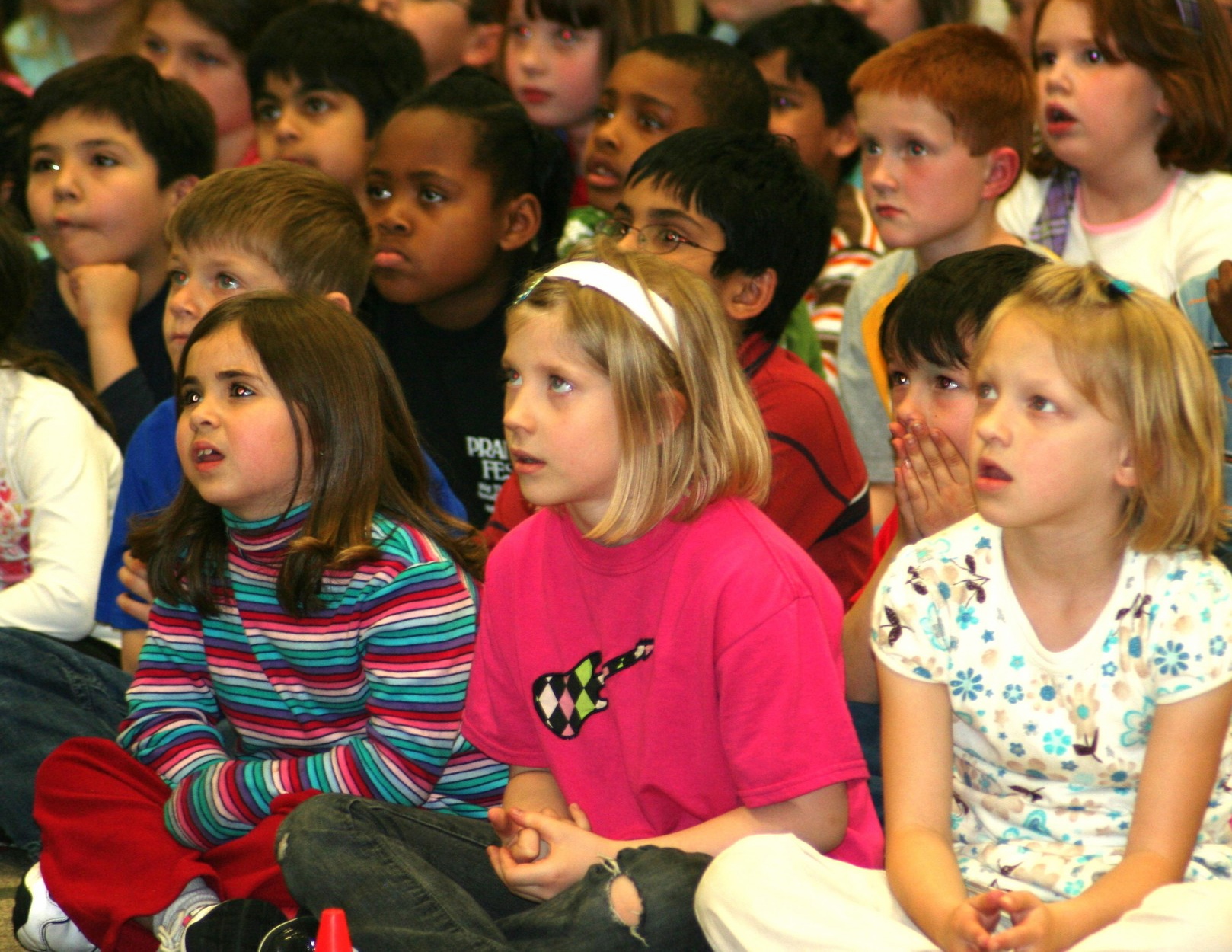 A student in a quiet moment of wonder during the show