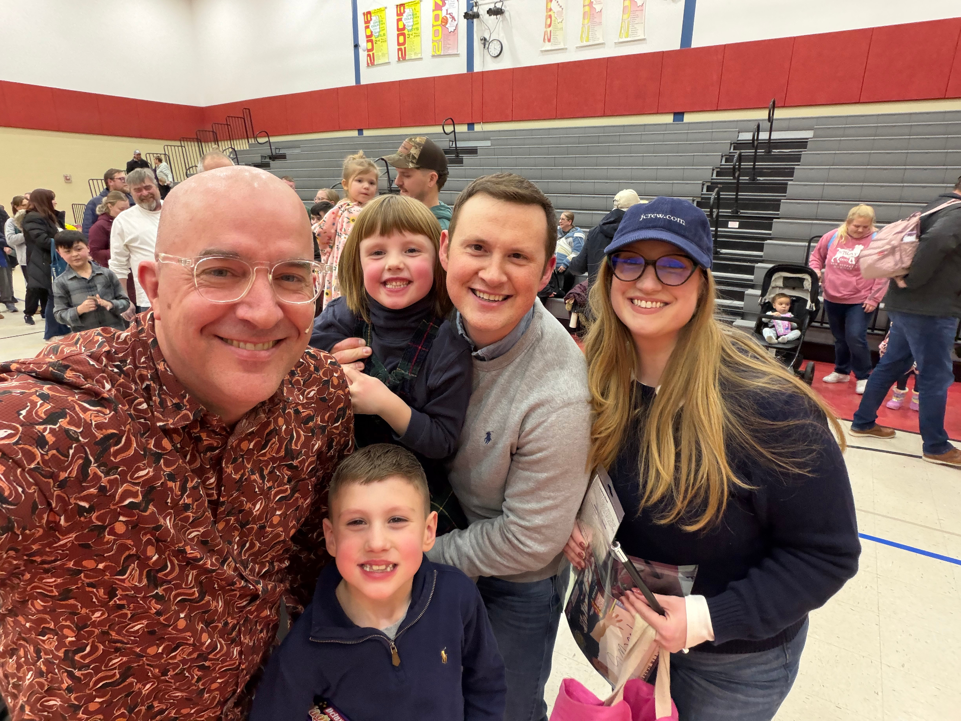 Tim with a happy family after a Lutheran school show
