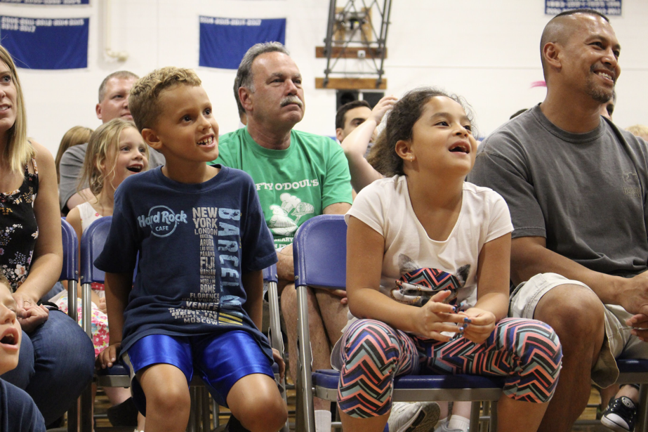 Families focused on Tim at the evening show.